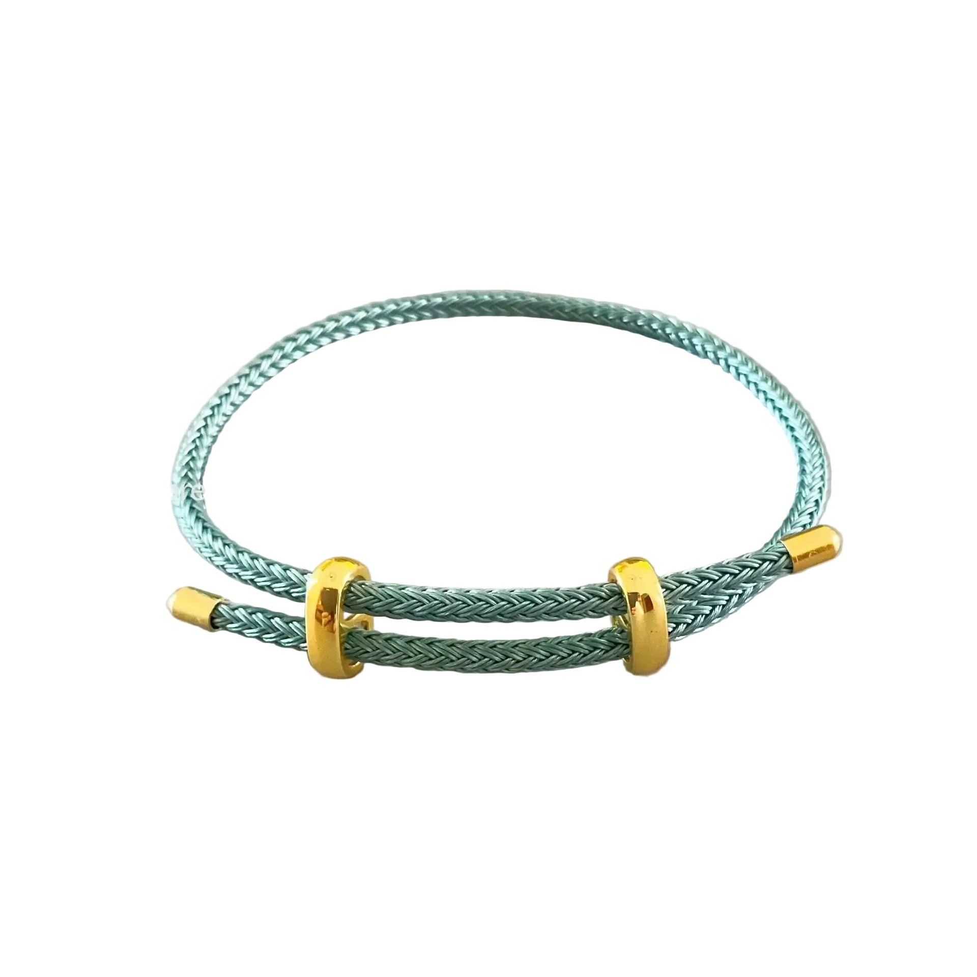 Green braided bracelet with gold accents on a light gray background