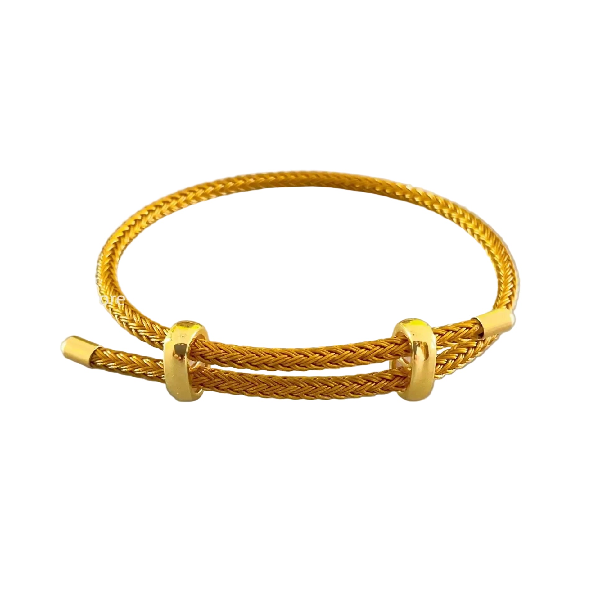 Gold bracelet on a light gray background