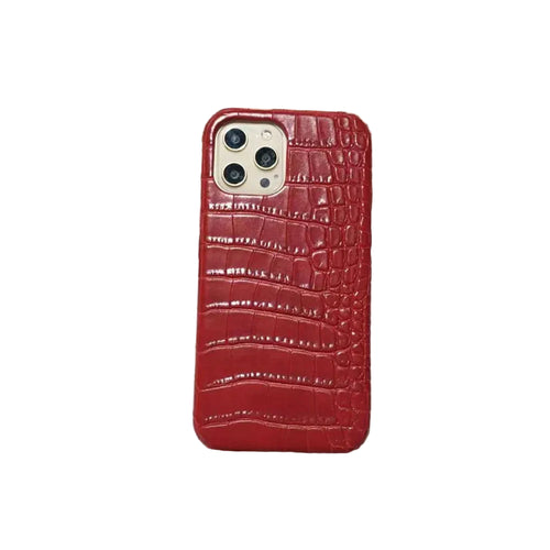Red crocodile pattern phone case on a newspaper background