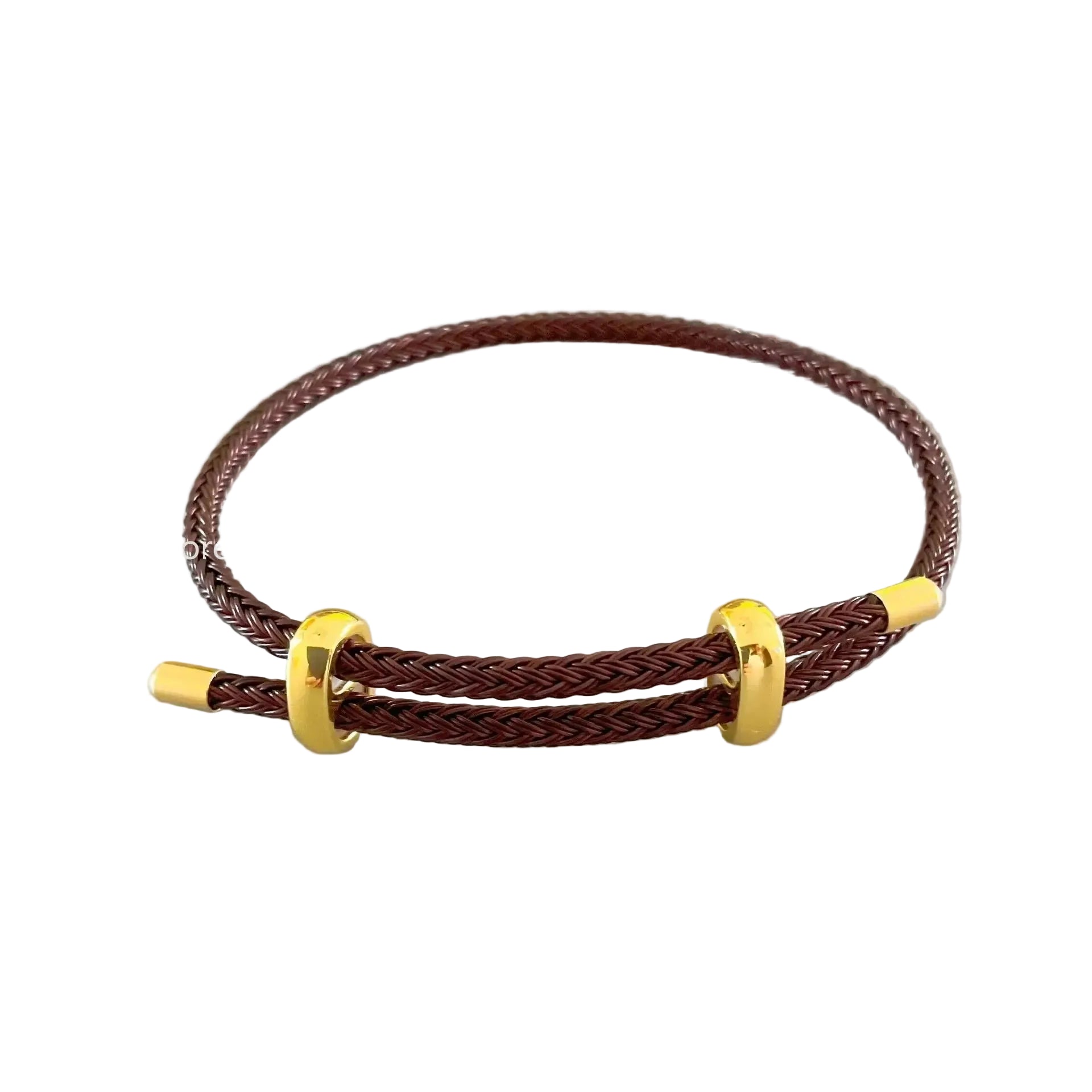 Brown braided bracelet with gold accents on a light gray background