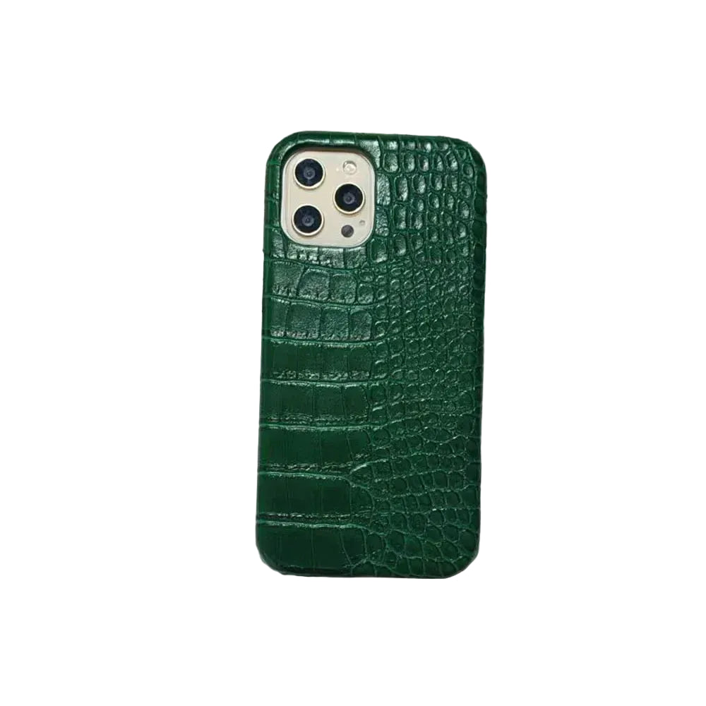 Green crocodile texture phone case on a magazine